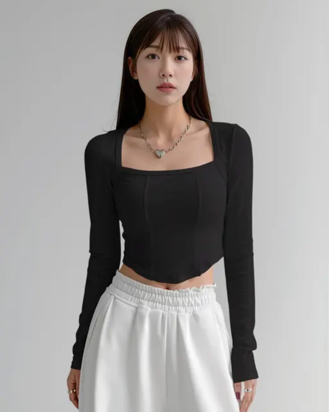 black crop top age Alt Text: Woman wearing a chocolate brown square neck full sleeve corset style ribbed crop top