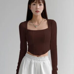 age Alt Text: Woman wearing a chocolate brown square neck full sleeve corset style ribbed crop top