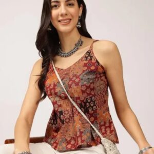 Woman wearing a rust multicolor boho printed sleeveless peplum cami top with spaghetti straps
